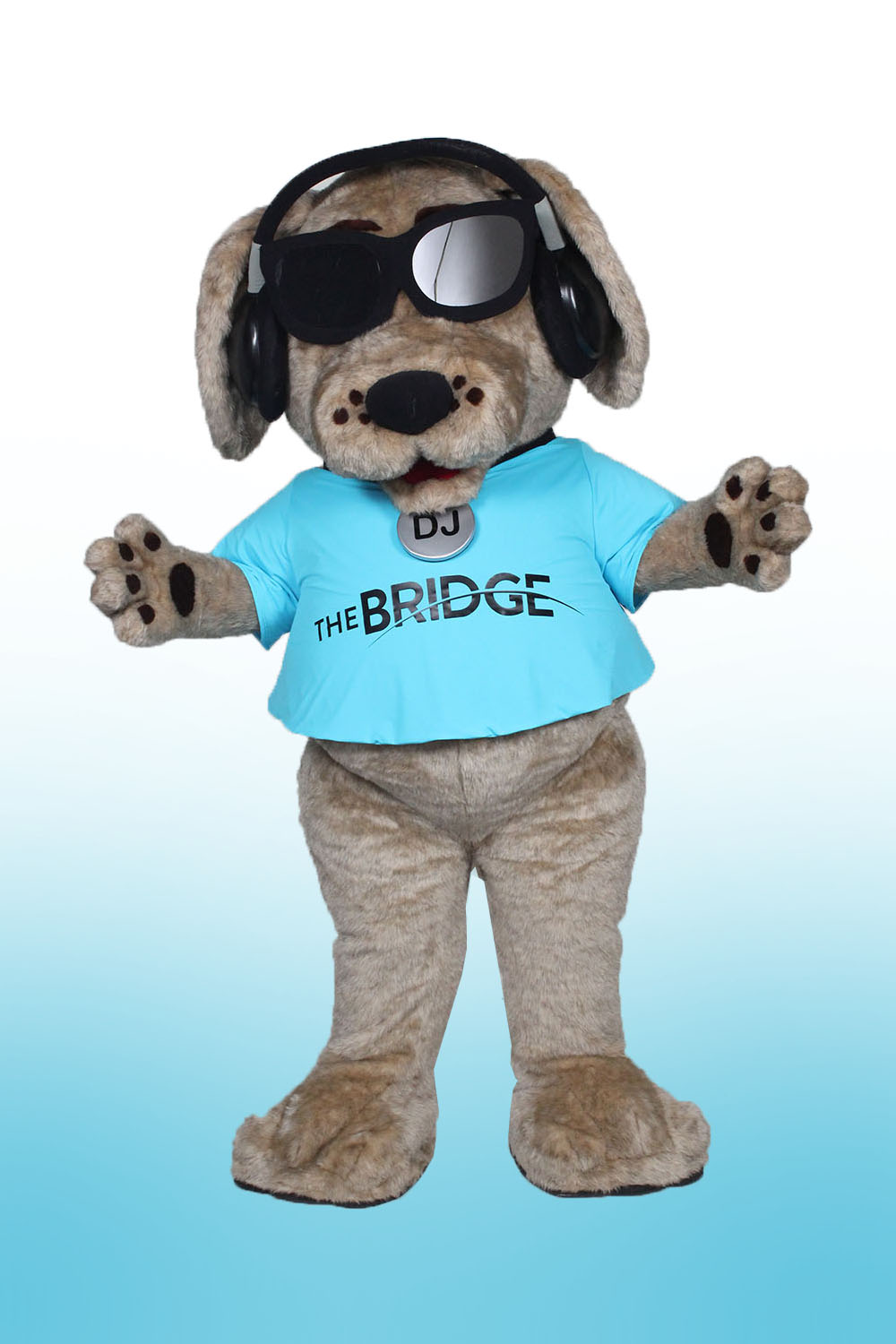 Dog Mascot with DJ headset, sunglasses, and blue t-shirt with The Bridge Logo
