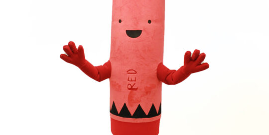 Inflatable Custom Mascot of a Red Crayon from the book bestselling book The Day the Crayons Came Home by Drew Daywalt. Mascot created by Costume Specialists